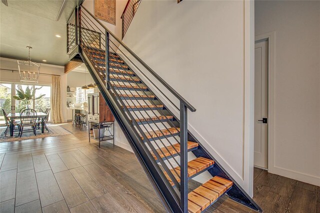 1212 W Wilshire Blvd, Nichols Hills, OK 73116 - staircase with a chandelier, wood finished floors, baseboards, and recessed lighting