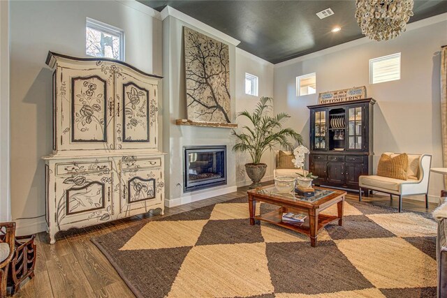 1212 W Wilshire Blvd, Nichols Hills, OK 73116 - living room with wood finished floors, a large fireplace, baseboards, ornamental molding, and recessed lighting