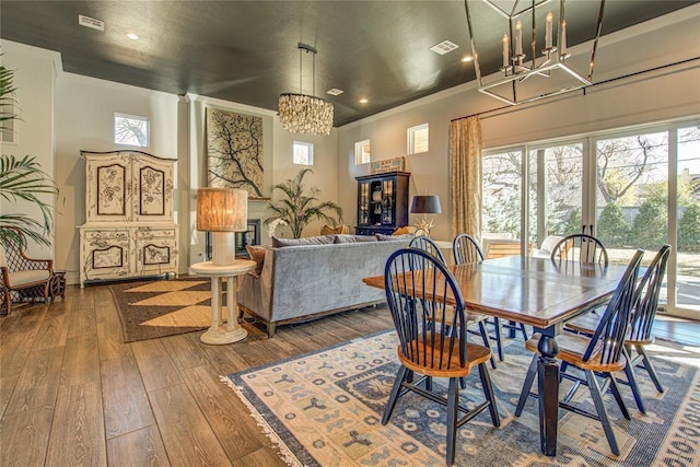1212 W Wilshire Blvd, Nichols Hills, OK 73116 - dining space featuring a chandelier, wood-type flooring, and recessed lighting