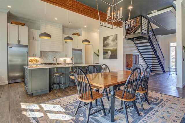 1212 W Wilshire Blvd, Nichols Hills, OK 73116 - dining area with hardwood / wood-style floors, a chandelier, stairway, and recessed lighting