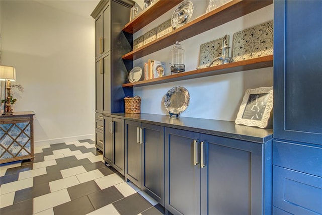 1212 W Wilshire Blvd, Nichols Hills, OK 73116 - hall featuring baseboards and tile patterned floors