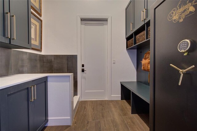 1212 W Wilshire Blvd, Nichols Hills, OK 73116 - mudroom with dark wood-style flooring and baseboards