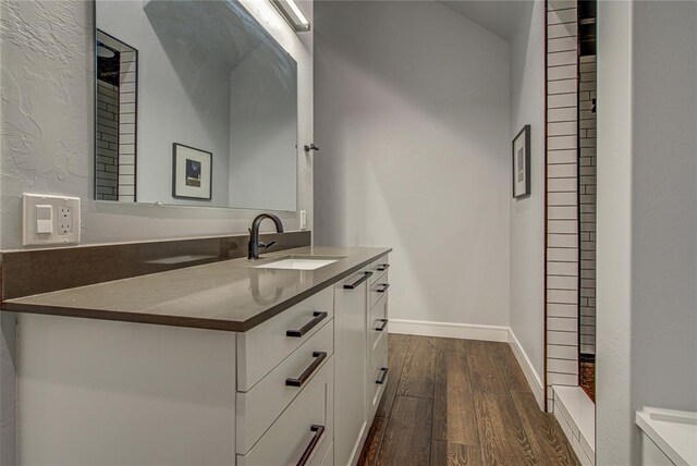 1212 W Wilshire Blvd, Nichols Hills, OK 73116 - bathroom featuring wood finished floors, vanity, a shower, and baseboards