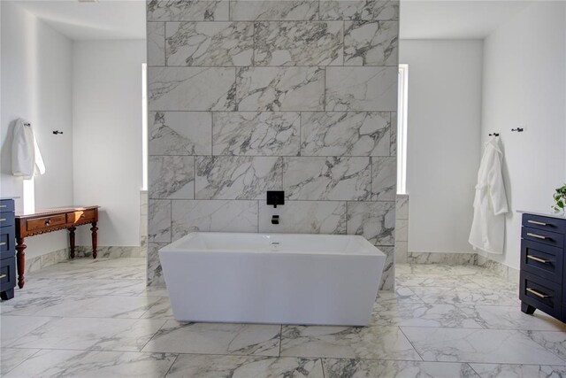 1212 W Wilshire Blvd, Nichols Hills, OK 73116 - full bath with marble tiled floors, a soaking tub, and vanity