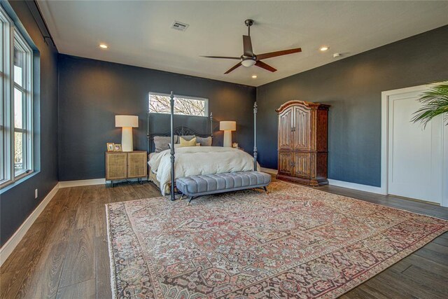 1212 W Wilshire Blvd, Nichols Hills, OK 73116 - bedroom featuring multiple windows, wood finished floors, recessed lighting, and baseboards