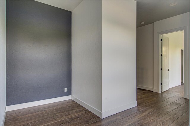 1212 W Wilshire Blvd, Nichols Hills, OK 73116 - unfurnished room featuring wood finished floors and baseboards