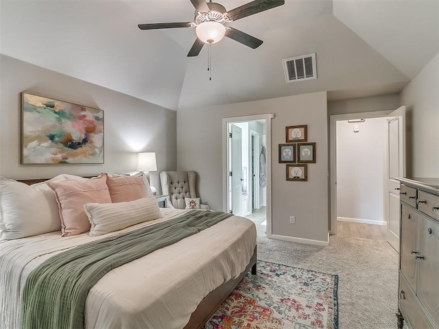 bedroom with ceiling fan, light colored carpet, visible vents, baseboards, and vaulted ceiling