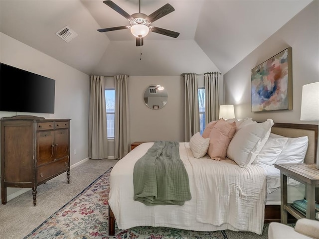 bedroom featuring light carpet, visible vents, baseboards, lofted ceiling, and ceiling fan