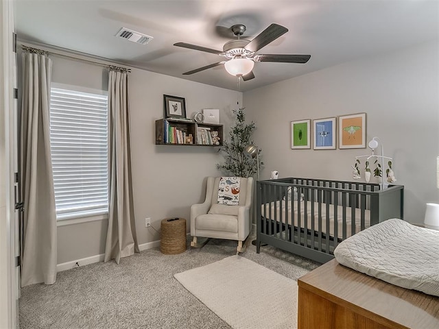 bedroom featuring carpet floors, visible vents, ceiling fan, and baseboards