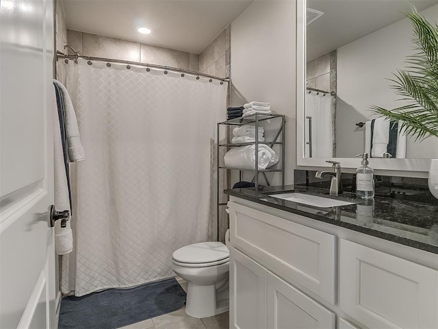 full bath featuring toilet, tile patterned flooring, and vanity