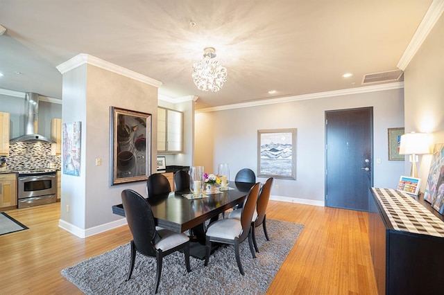200 S Oklahoma Ave Unit 305, Oklahoma City, OK 73104 - dining space featuring light wood-type flooring, recessed lighting, a chandelier, and crown molding