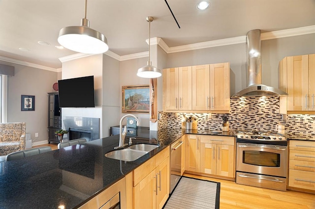 200 S Oklahoma Ave Unit 305, Oklahoma City, OK 73104 - kitchen with stainless steel appliances, wall chimney exhaust hood, light brown cabinets, open floor plan, and ornamental molding