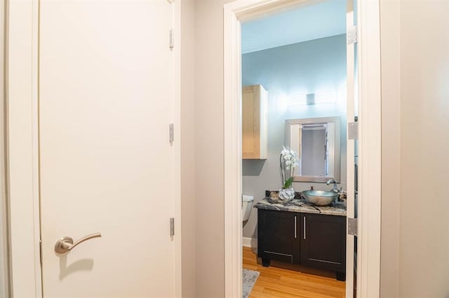 200 S Oklahoma Ave Unit 305, Oklahoma City, OK 73104 - corridor with a sink and light wood-style floors