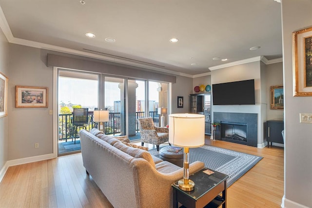 200 S Oklahoma Ave Unit 305, Oklahoma City, OK 73104 - living room featuring crown molding, wood finished floors, a fireplace, and recessed lighting