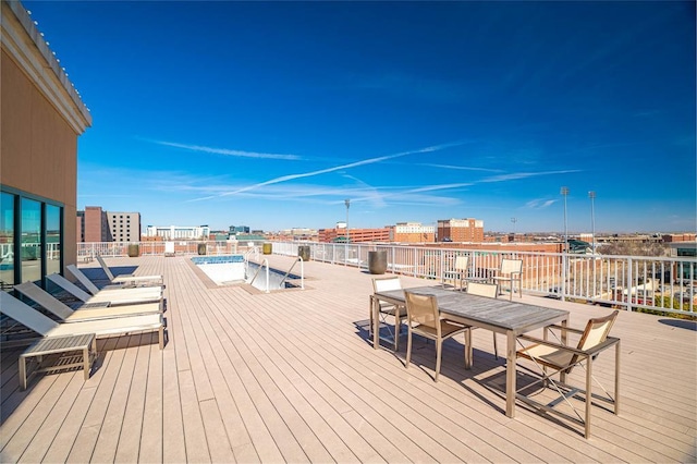 200 S Oklahoma Ave Unit 305, Oklahoma City, OK 73104 - wooden deck featuring a pool and outdoor dining area