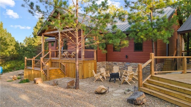 view of jungle gym featuring stairway and a wooden deck