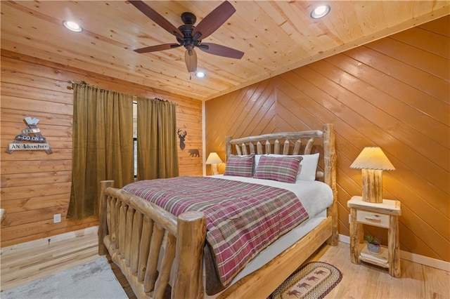 bedroom featuring wooden ceiling, light wood finished floors, wooden walls, and recessed lighting