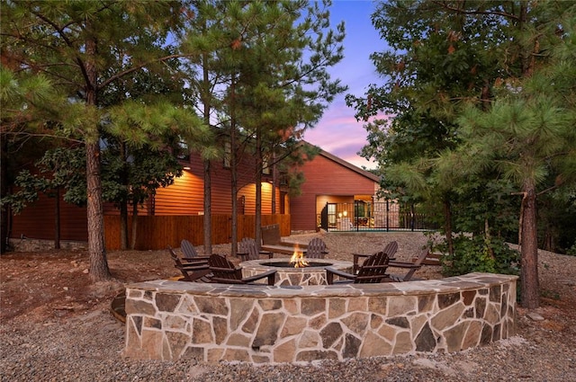 view of patio / terrace with an outdoor fire pit and fence