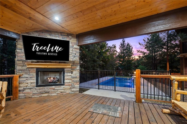 deck with a fenced in pool