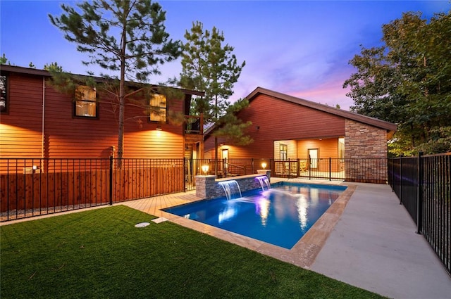 pool at dusk featuring a fenced in pool, fence, a lawn, and a patio