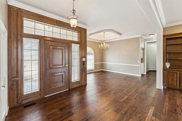 entryway with visible vents, dark wood-style floors, baseboards, and ornamental molding