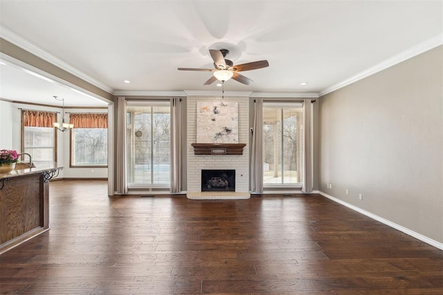 unfurnished living room featuring dark wood-type flooring and a healthy amount of sunlight