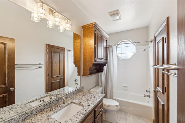 bathroom featuring visible vents, vanity, toilet, and shower / tub combo