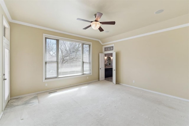 unfurnished bedroom with light carpet, visible vents, and ornamental molding