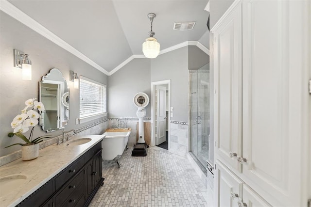 full bathroom with visible vents, a stall shower, ornamental molding, a sink, and vaulted ceiling