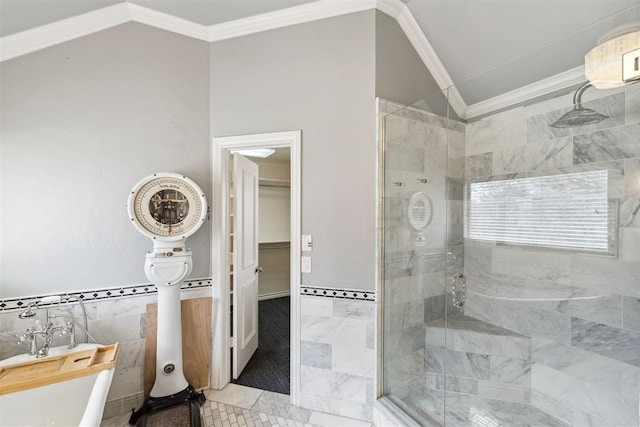 full bath with crown molding, vaulted ceiling, tiled shower, a soaking tub, and tile walls