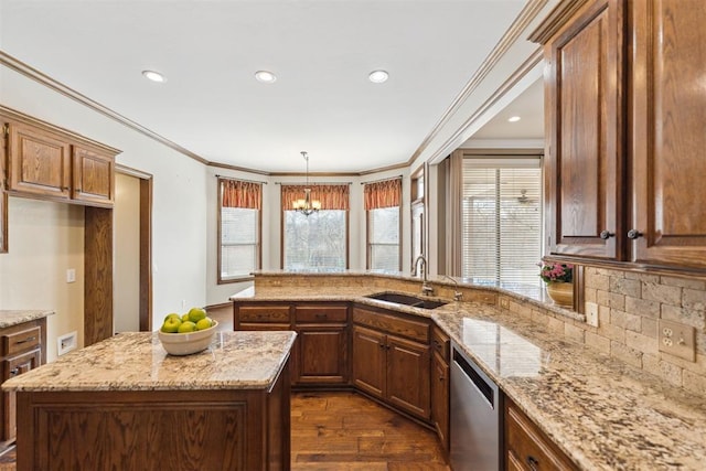 kitchen featuring light stone counters, ornamental molding, a sink, dark wood-type flooring, and dishwasher