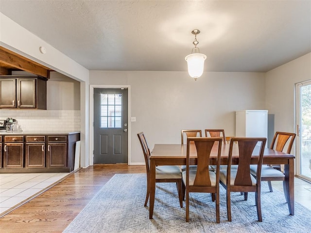 dining area with light wood finished floors