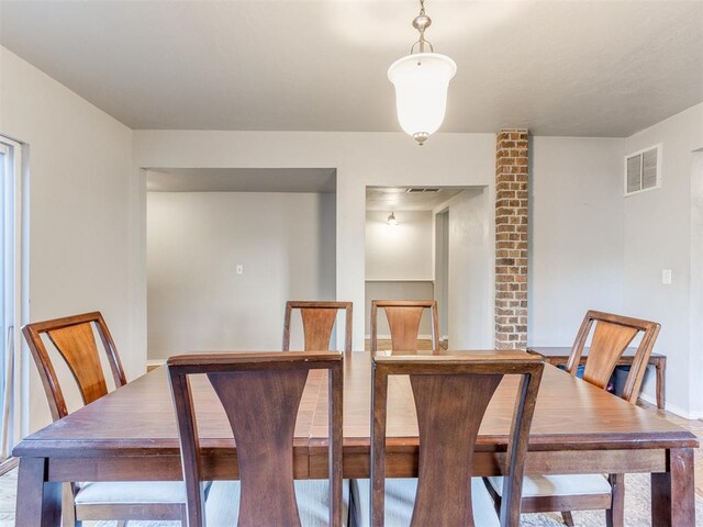 dining area featuring baseboards and visible vents