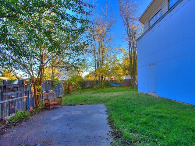 view of yard with a patio and a fenced backyard