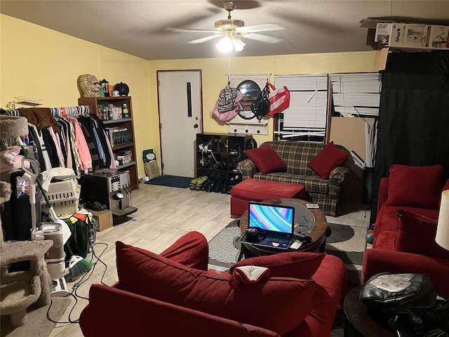 living area featuring light wood-type flooring and a ceiling fan