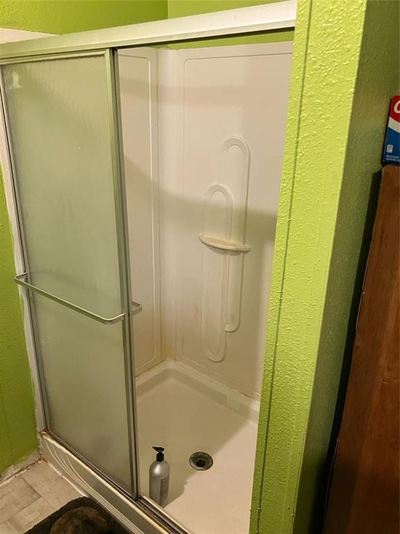 bathroom with a stall shower