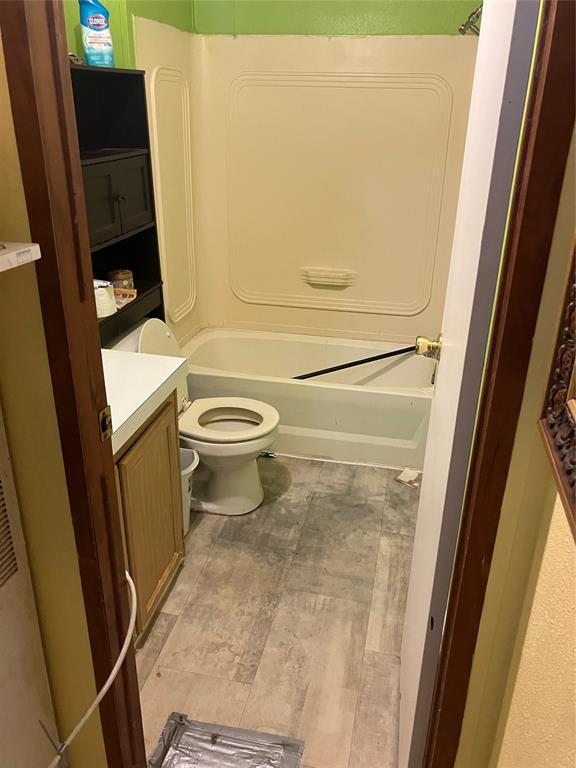 full bath with toilet, shower / bath combination, and vanity