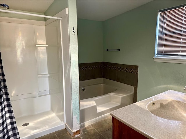 full bathroom featuring a shower stall, tile patterned flooring, a bath, and vanity