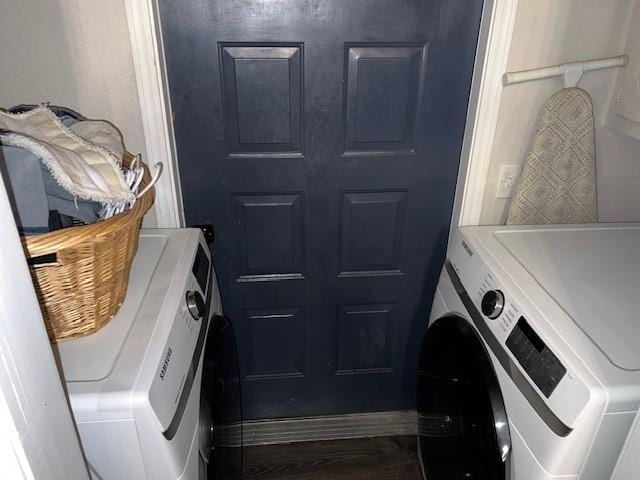 washroom with washing machine and clothes dryer and laundry area