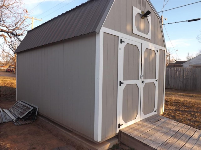 view of shed with fence