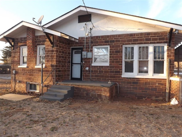 view of front of house with brick siding