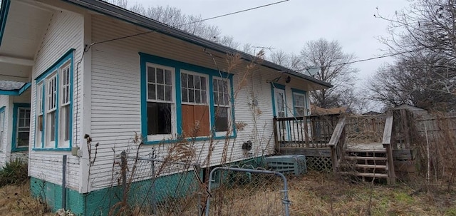 view of home's exterior featuring fence