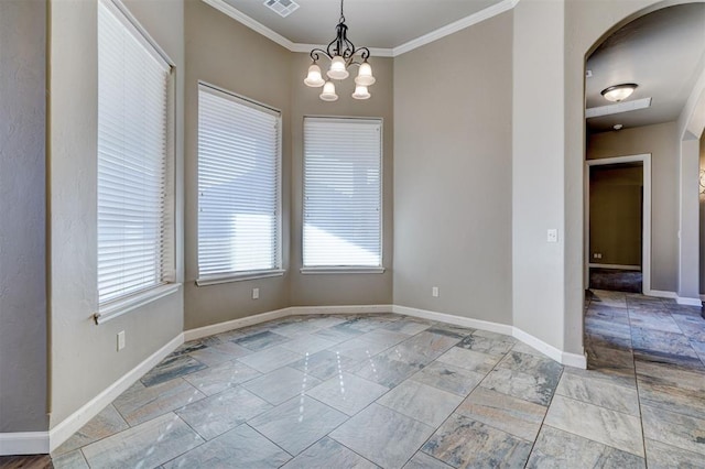 unfurnished dining area with plenty of natural light, baseboards, arched walkways, and ornamental molding