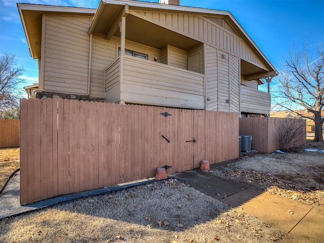 view of home's exterior featuring fence