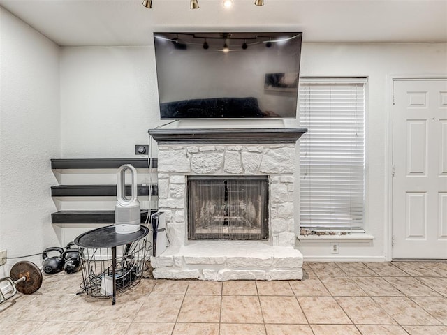 living room featuring light tile patterned floors and a fireplace