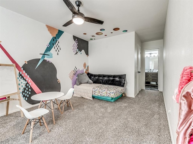 carpeted bedroom featuring ceiling fan and baseboards