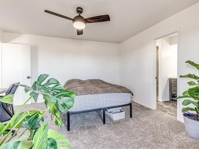 bedroom with ceiling fan, carpet flooring, and baseboards