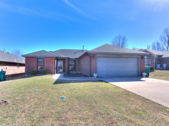 ranch-style house featuring a garage, brick siding, concrete driveway, and a front yard