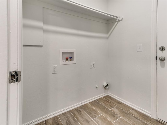 washroom featuring laundry area, baseboards, hookup for a washing machine, wood tiled floor, and hookup for an electric dryer