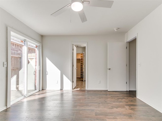 spare room with a ceiling fan and wood finished floors